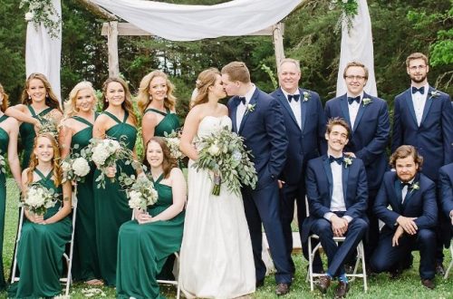 navy suit with green dress