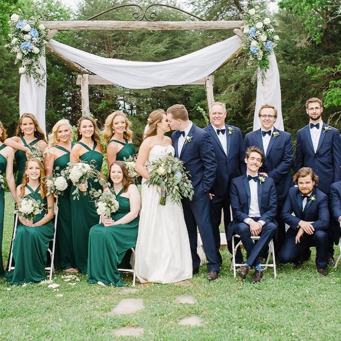 navy suit with green dress